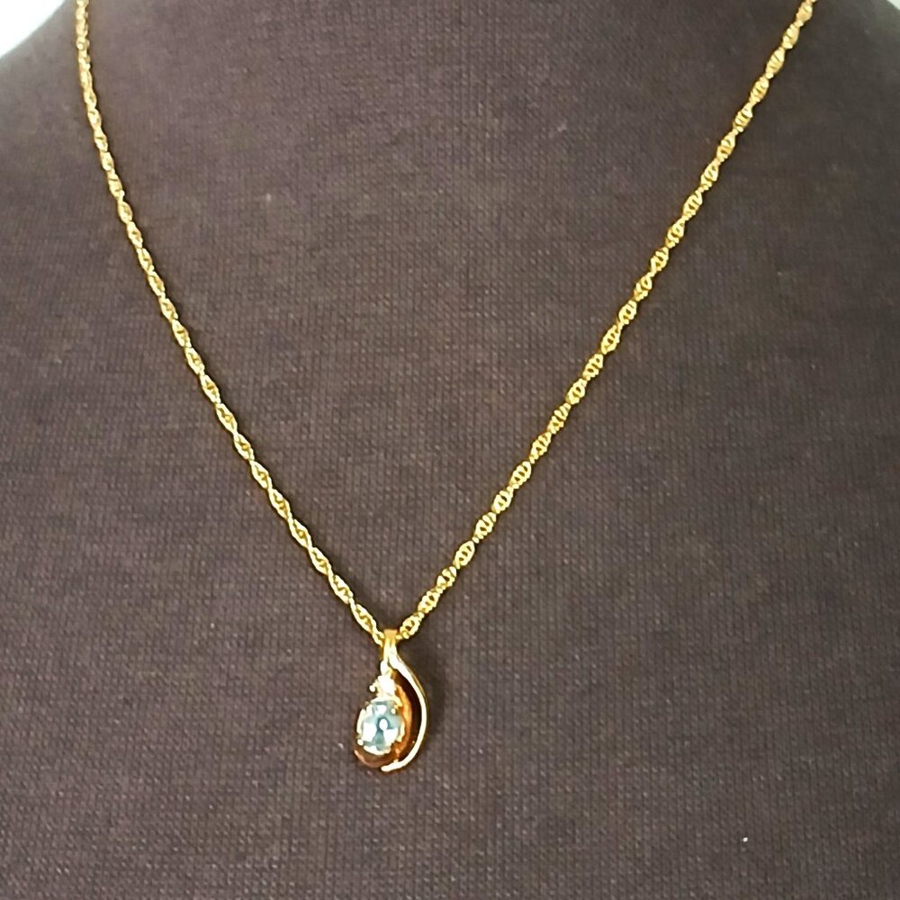 Gold Coloured Necklace with Blue Topaz Pendant